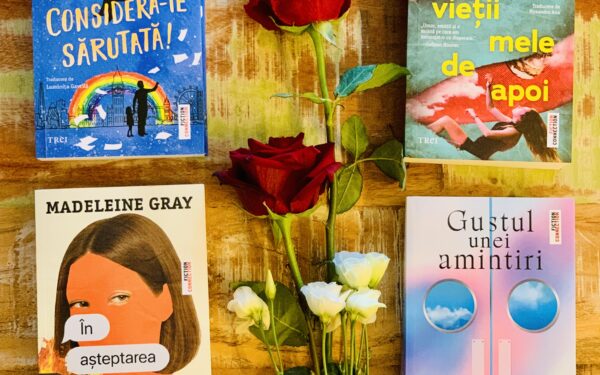 Patru romane de ficțiune de la Editura Trei așezate pe un fundal rustic de lemn, alături de trandafiri roșii și flori albe, ideale pentru mărțișor și Ziua Femeii.